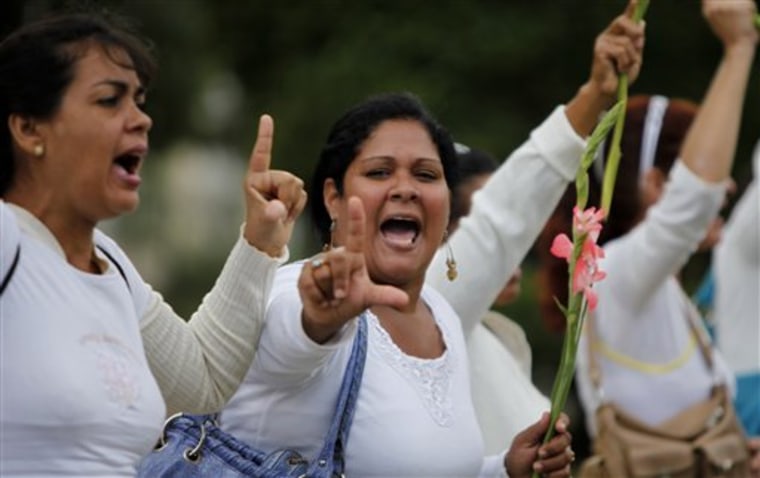 Members of the Cuban dissident group Ladies in White demonstrate during their weekly march in Havana, Cuba on Sunday. The wives and mothers of Cuba's most prominent political prisoners protested to demand the government honor an agreement to release their loved ones by the end of the day.